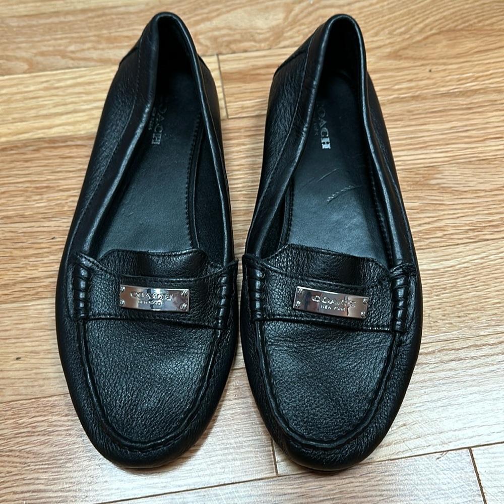 Black COACH leather flats